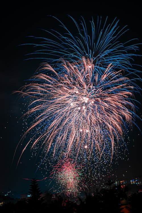 Multicolored fireworks in the sky above the city