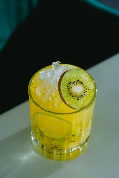 A Yellow Cocktail with a Slice of Kiwi 