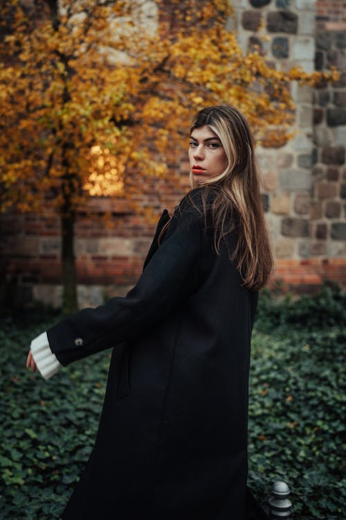 Blonde Woman Wearing Coat in a Park