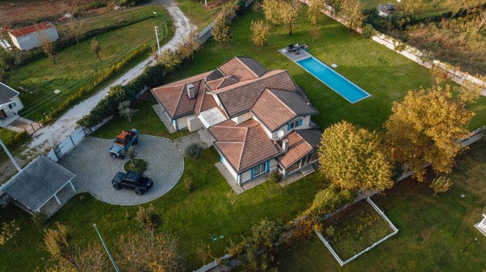 Aerial view of a house with a pool — photo by Ahmet Kurt on Pexels