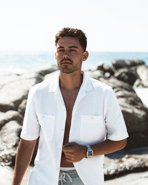 Model in a White Shirt with Short Sleeves on the Beach