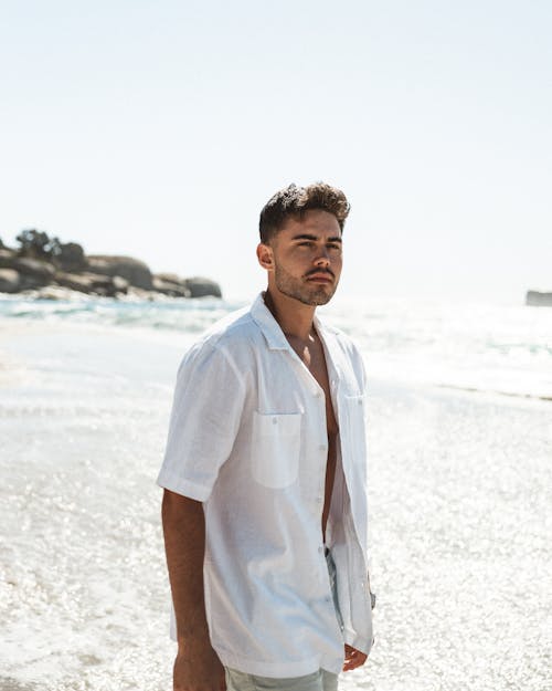 Portrait of Man Wearing White Shirt on a Beach