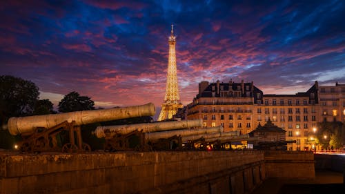 Eiffel Tower behind Artillery Cannons at Dusk