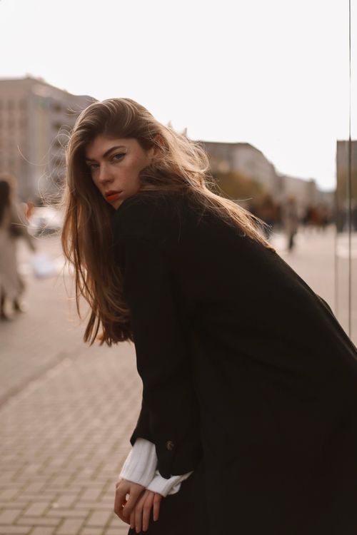 Free Stylish woman poses on urban Berlin street, showcasing modern fashion trends. Stock Photo