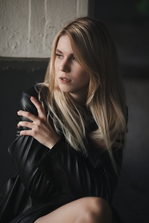Blonde Woman Posing in Black Leather Jacket