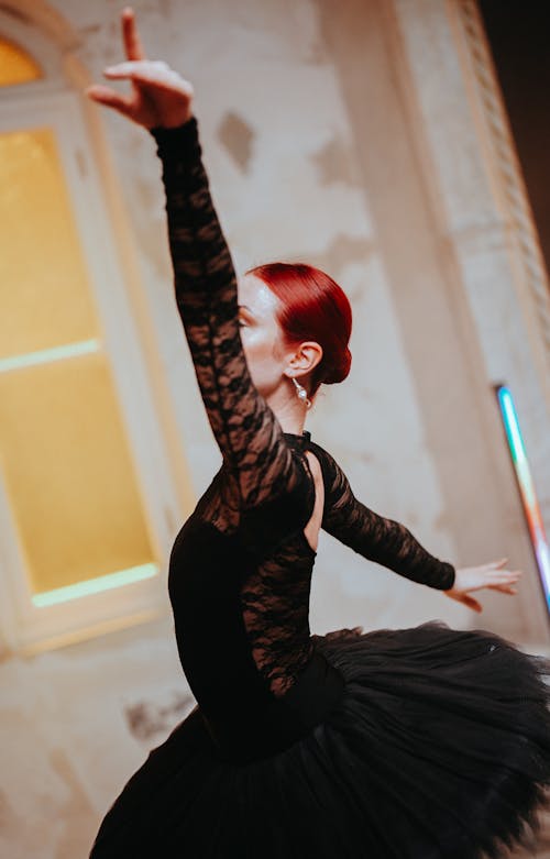 Ballet Dancer Performing in Black Dress