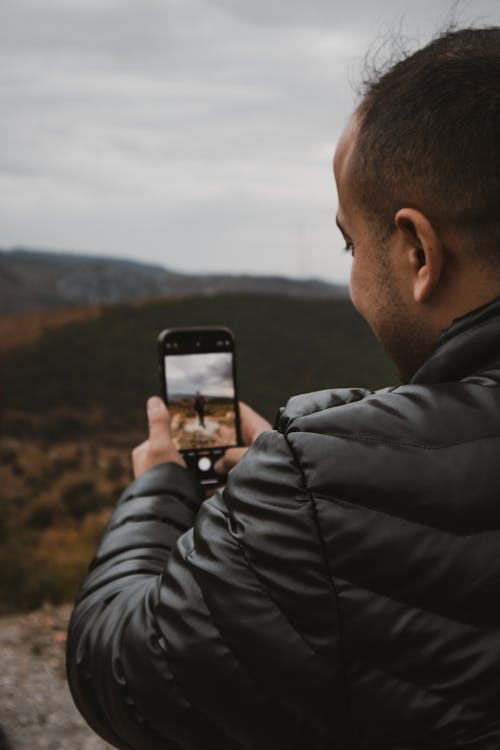 Free Man Taking Photo with Smartphone Stock Photo
