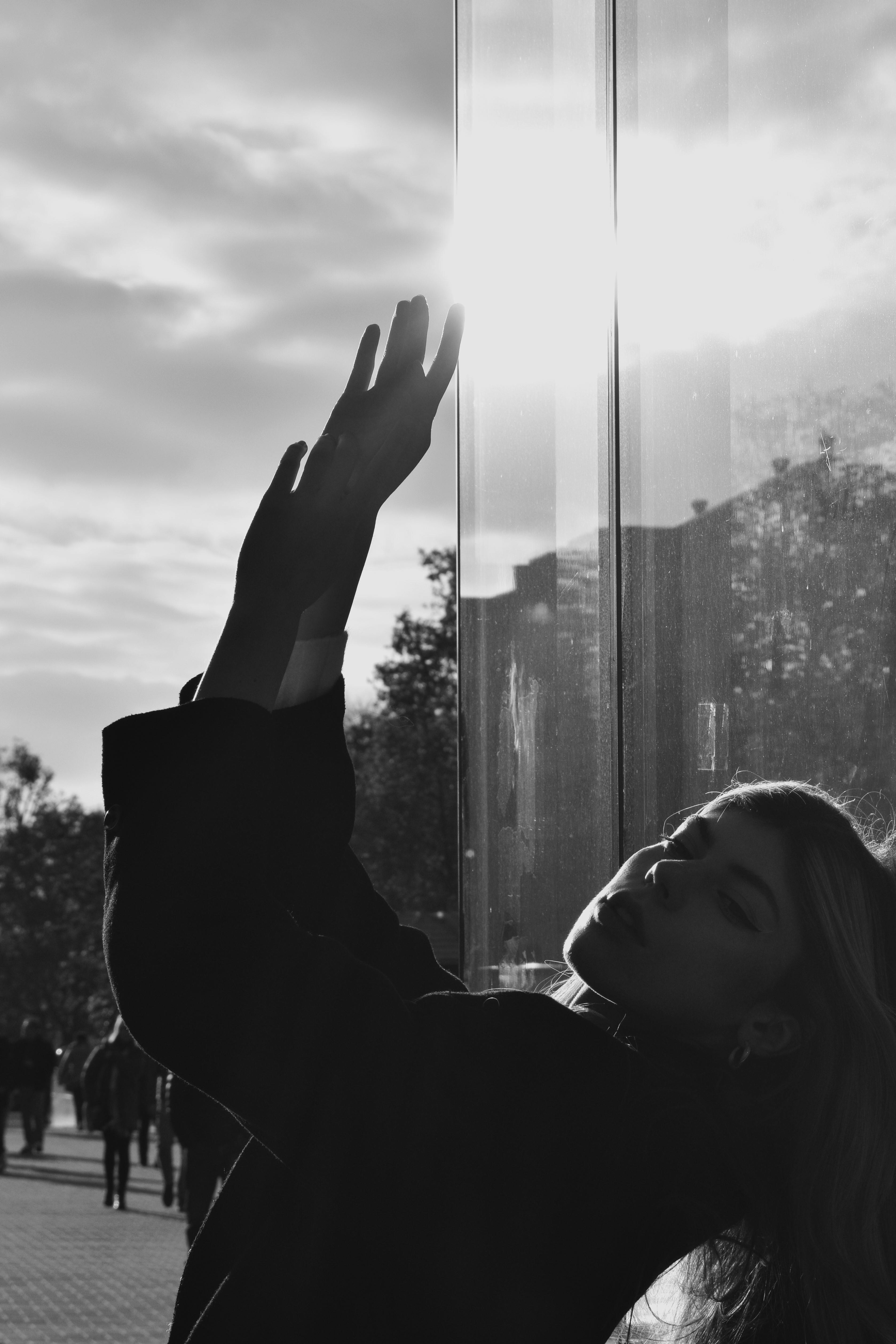 Young Woman Posing on Street in Sunlight · Free Stock Photo
