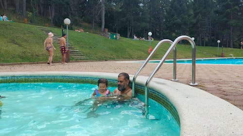 Father and Daughter in the pool