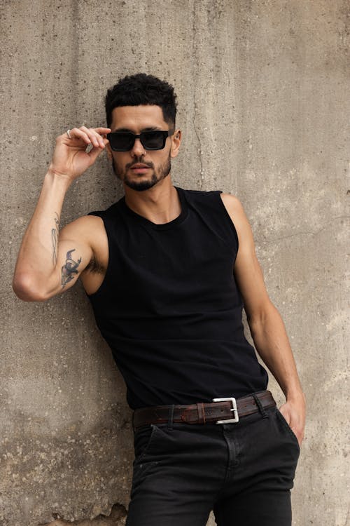Portrait of Man in Sunglasses and Black Tank Top
