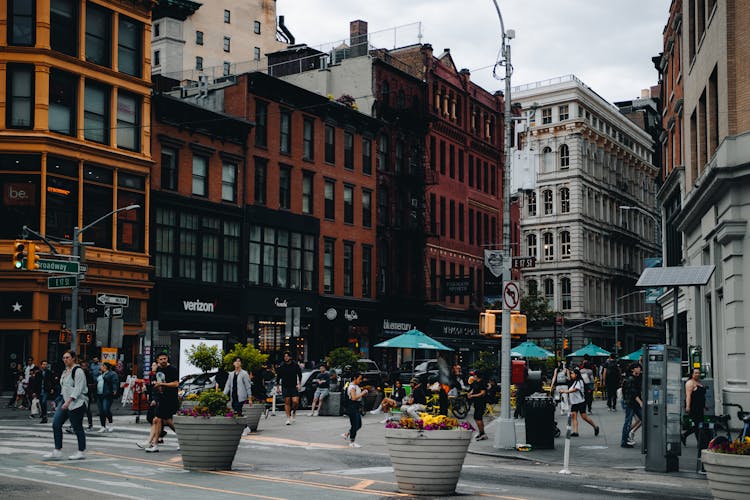 People Walking On Square In City