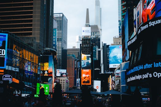 Vibrant view of Times Square with towering skyscrapers and illuminated billboards in New York City.