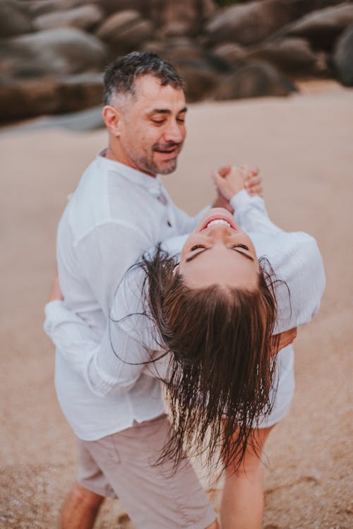 Couple Dancing on Sandy Beach