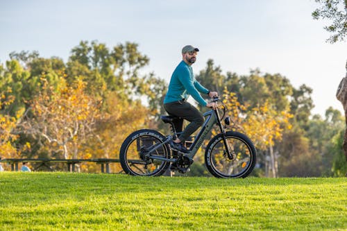 Man Riding Electric Bike at Park
