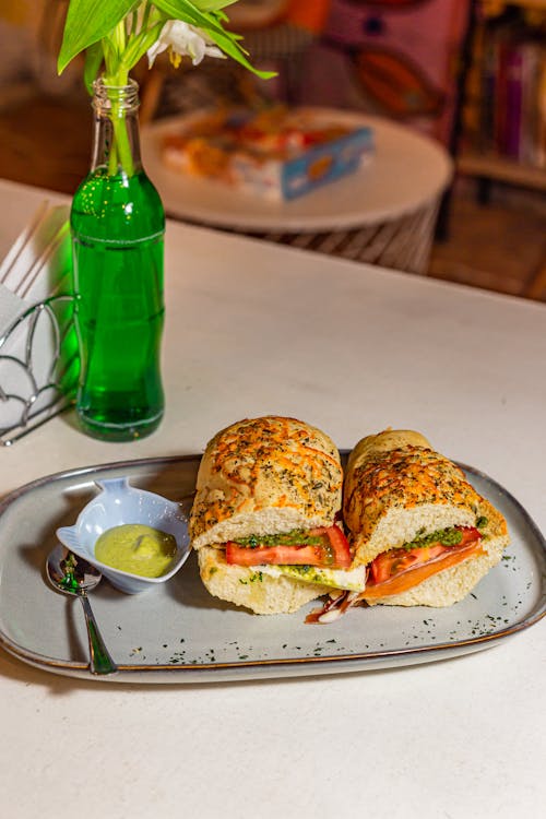 Sandwiches with Tomato Cheese and Cold Cuts on a Tray with Dipping Sauce