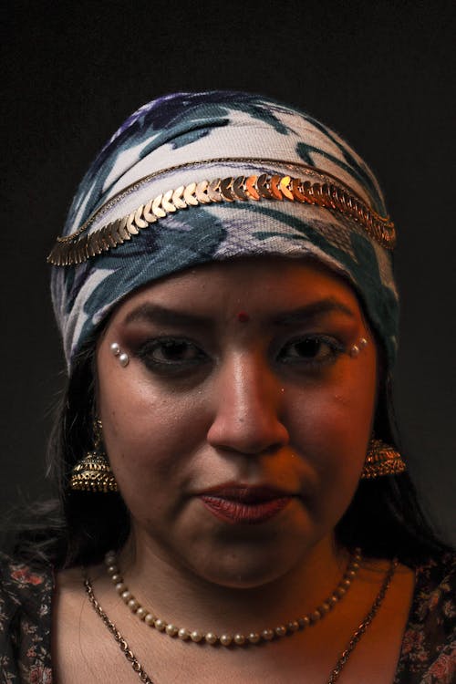 Portrait of a Woman Wearing a Headscarf and Jewellery