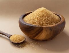Raw golden sugar in a rustic wooden bowl — photo by D MO on Pexels