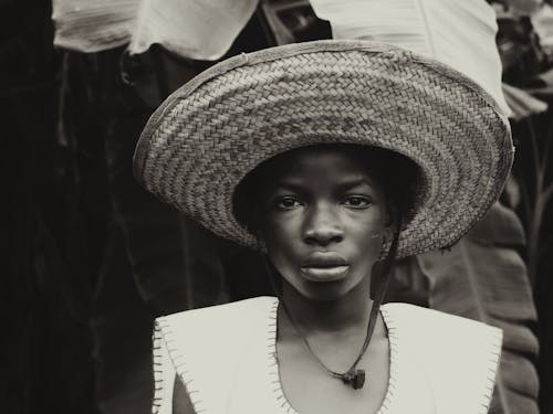 Portrait of Woman Wearing Wicker Hat
