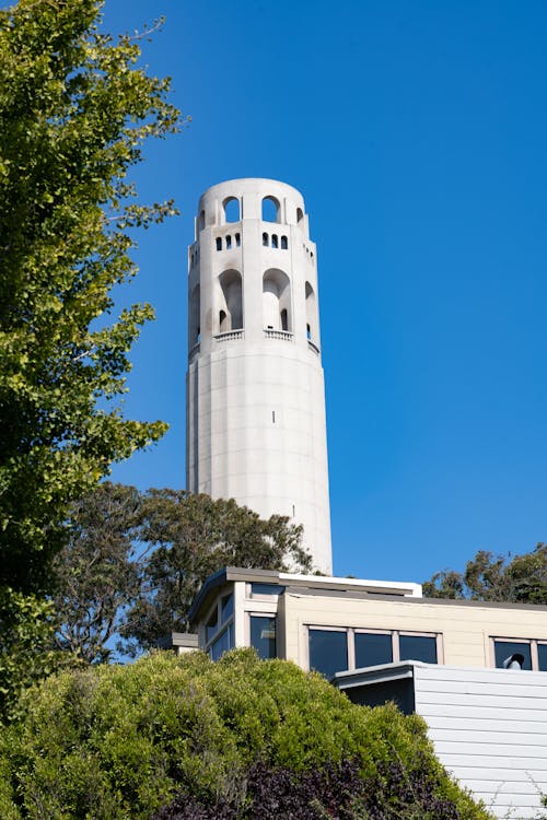 White Building with a Tower against Blue Sky