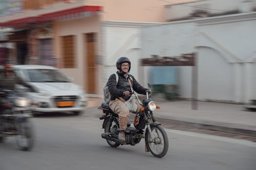 Smiling Man Riding a Motorcycle 