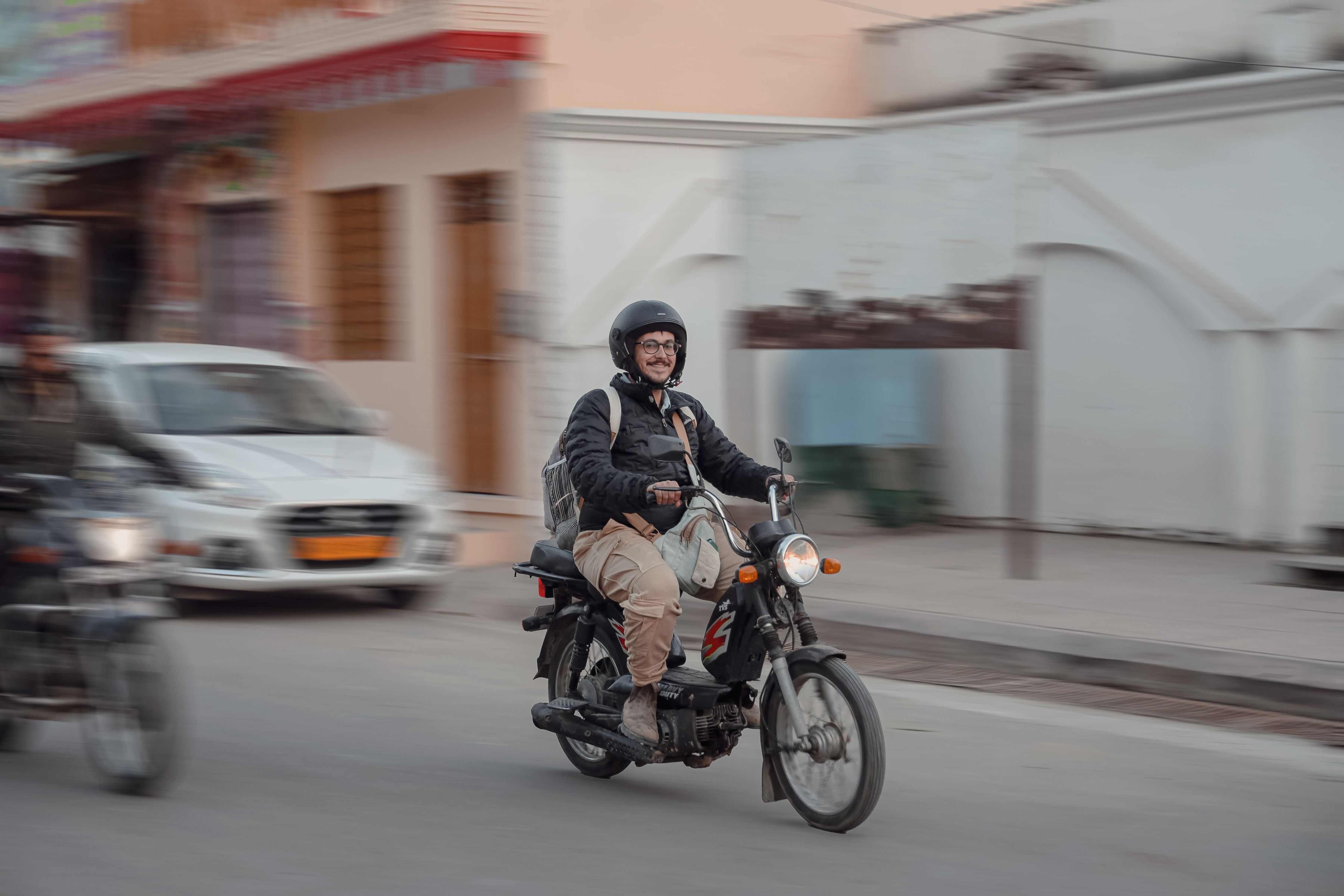 Smiling Man Riding a Motorcycle · Free Stock Photo