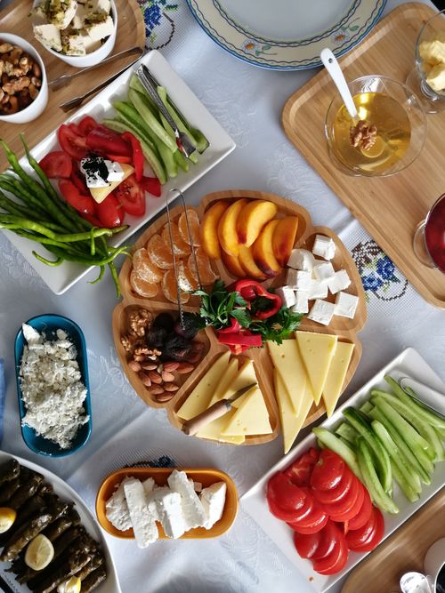 Free A vibrant Turkish breakfast spread featuring fresh fruits, cheeses, and traditional dishes on a dining table. Stock Photo