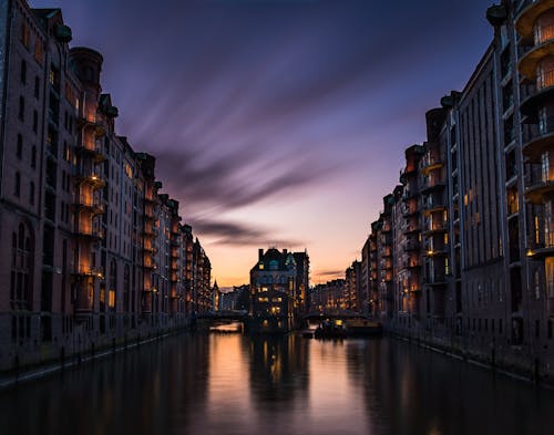 Illuminated Tenements by Canal in Hamburg