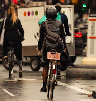 Bicyclists commuting in the city, showcasing urban transportation and lifestyle.