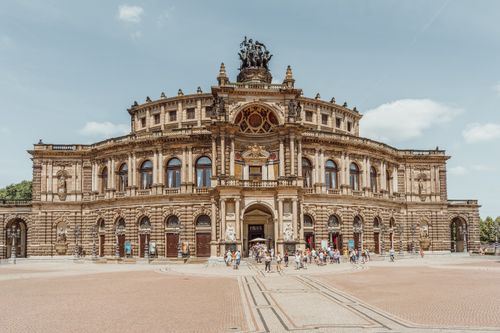 Free Semperoper Opera House in Dresden, Germany showing beautiful neoclassical architecture under clear skies. Stock Photo