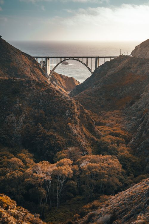 Free Capture of Bixby Creek Bridge in Big Sur, California with a dramatic sunset sky. Stock Photo