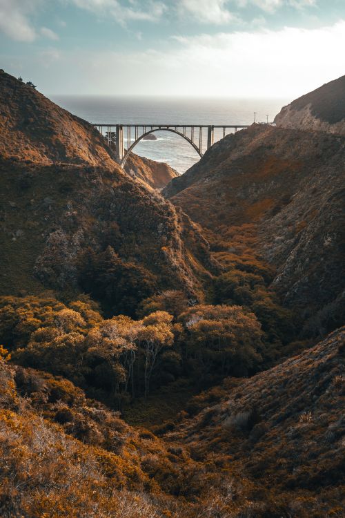 Free Stunning landscape of Bixby Bridge in Big Sur with rugged hills and a scenic ocean view. Stock Photo