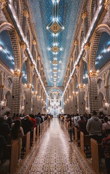 Ornate interior of a church in Jardín, Colombia, during a mass with an impressive architectural design.