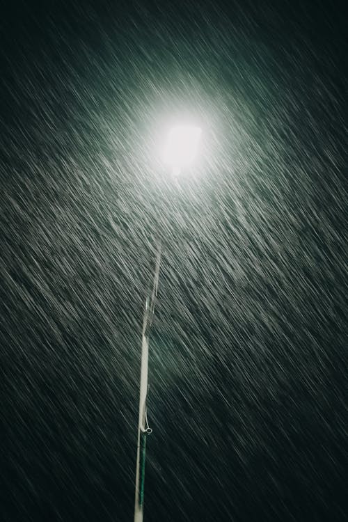 Rain over Street Lamp at Night