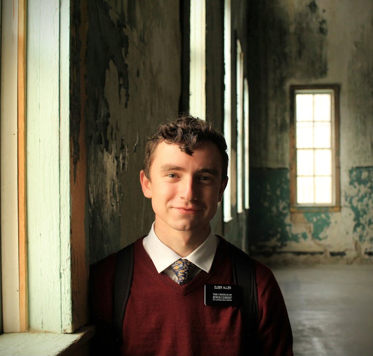 Smiling Student In Necktie And Sweater 