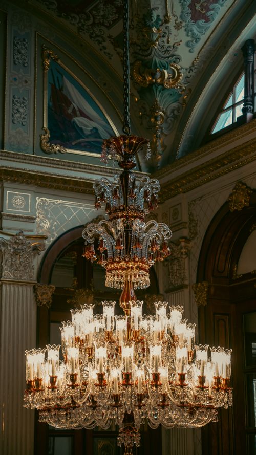 Free Lavish chandelier hanging in the ornate interior of Istanbul's Dolmabahçe Palace. Stock Photo
