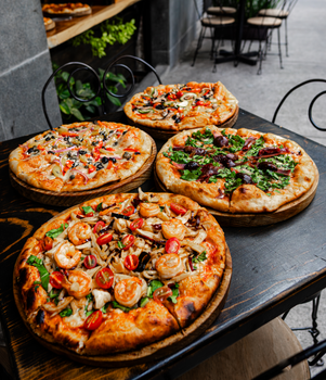 Enjoy diverse gourmet pizzas at a stylish pizzeria in Ciudad de Mexico, ideal for food lovers.