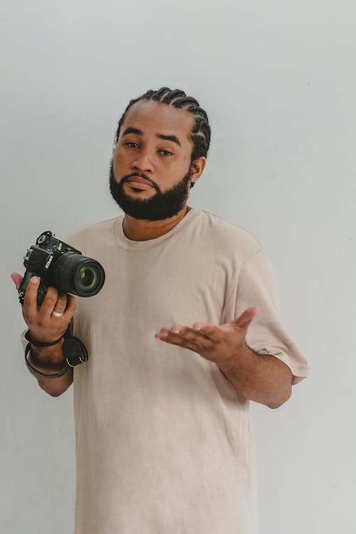 Bearded Man Holding a Camera 