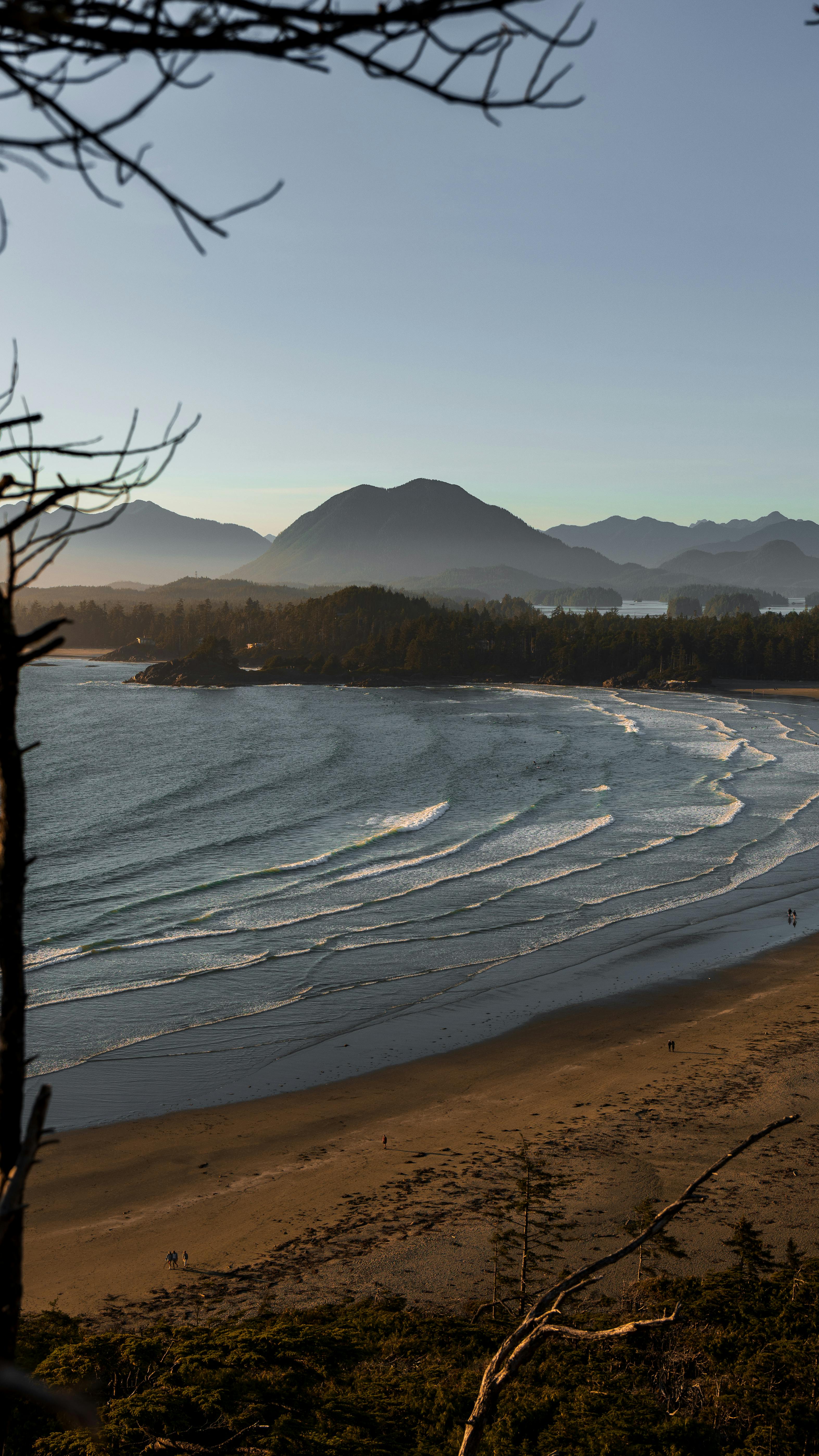 view of waves washing up the cox bay beach in british columbia canada