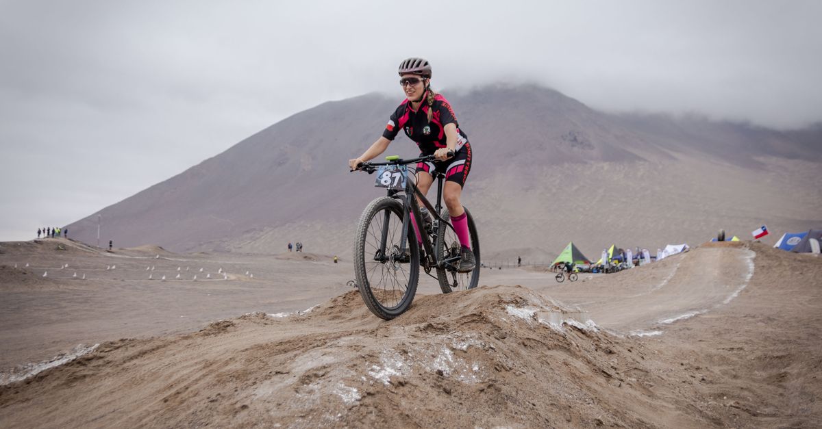 Local athletes training on a dirt track with mountains in the background
