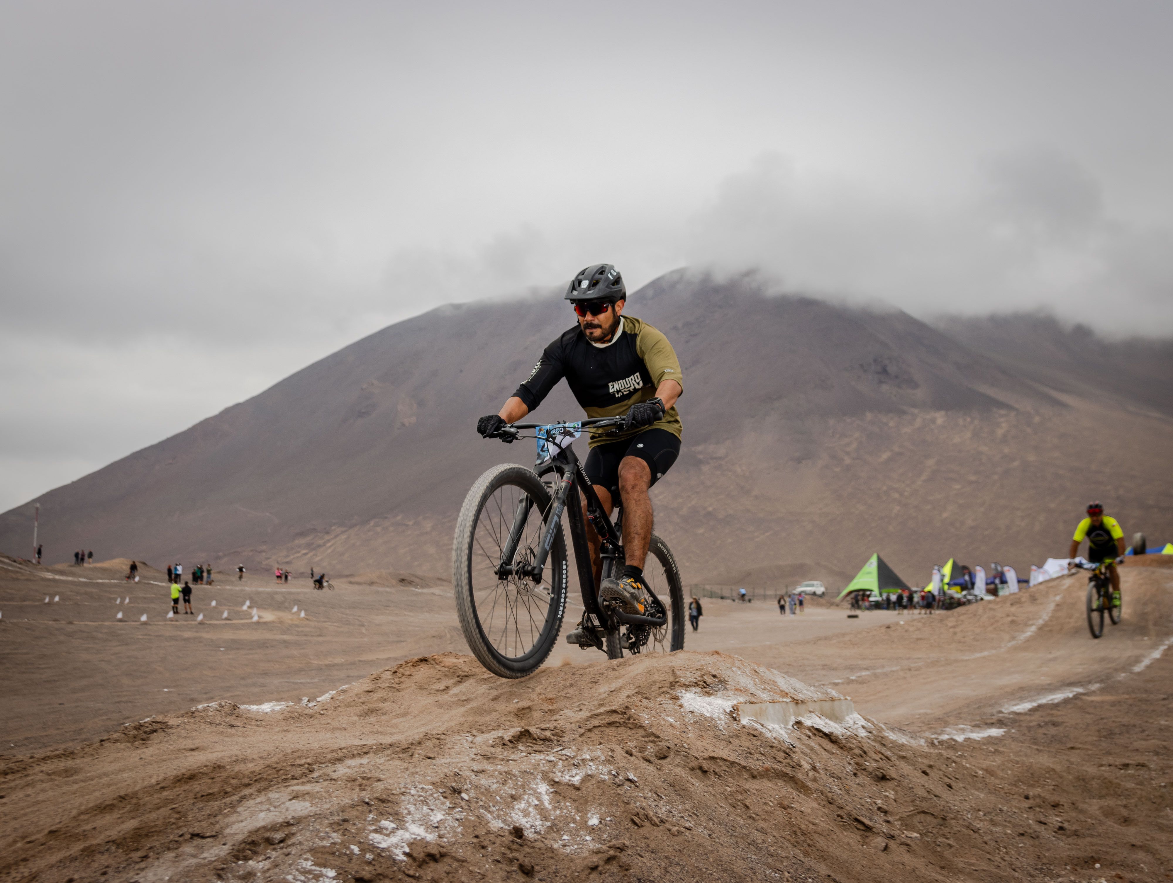 Man Riding a Bike on a Desert · Free Stock Photo