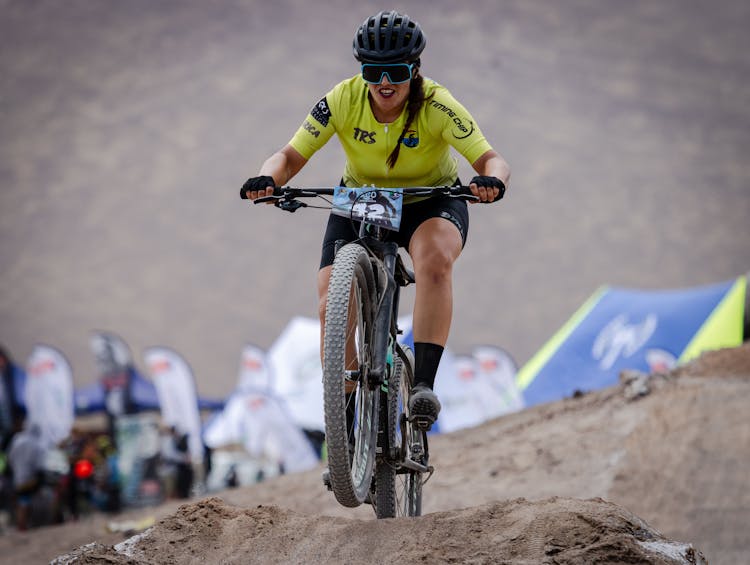 Woman Riding Bicycle In An Off Road Competition