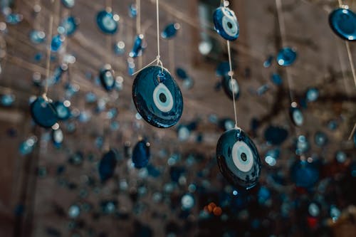 Close-up of Glass Evil Eye Beads Hanging on Ropes 