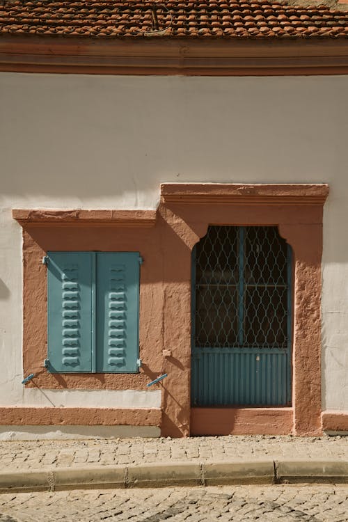 Door and a Window with Shutters 