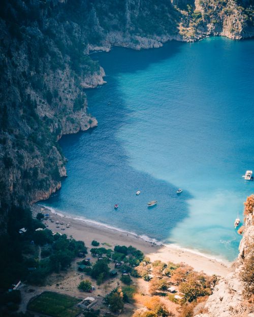 Free Stunning aerial view of Butterfly Valley, Turkey, showcasing pristine turquoise waters and lush surroundings. Stock Photo