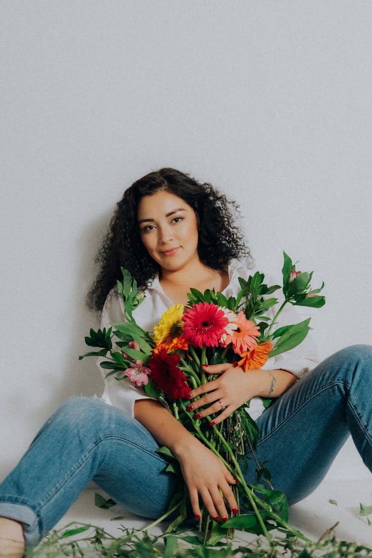 Woman Posing With Bouquet Of Flowers