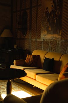 An inviting vintage lounge with retro furniture and warm sunlight creating a cozy atmosphere.