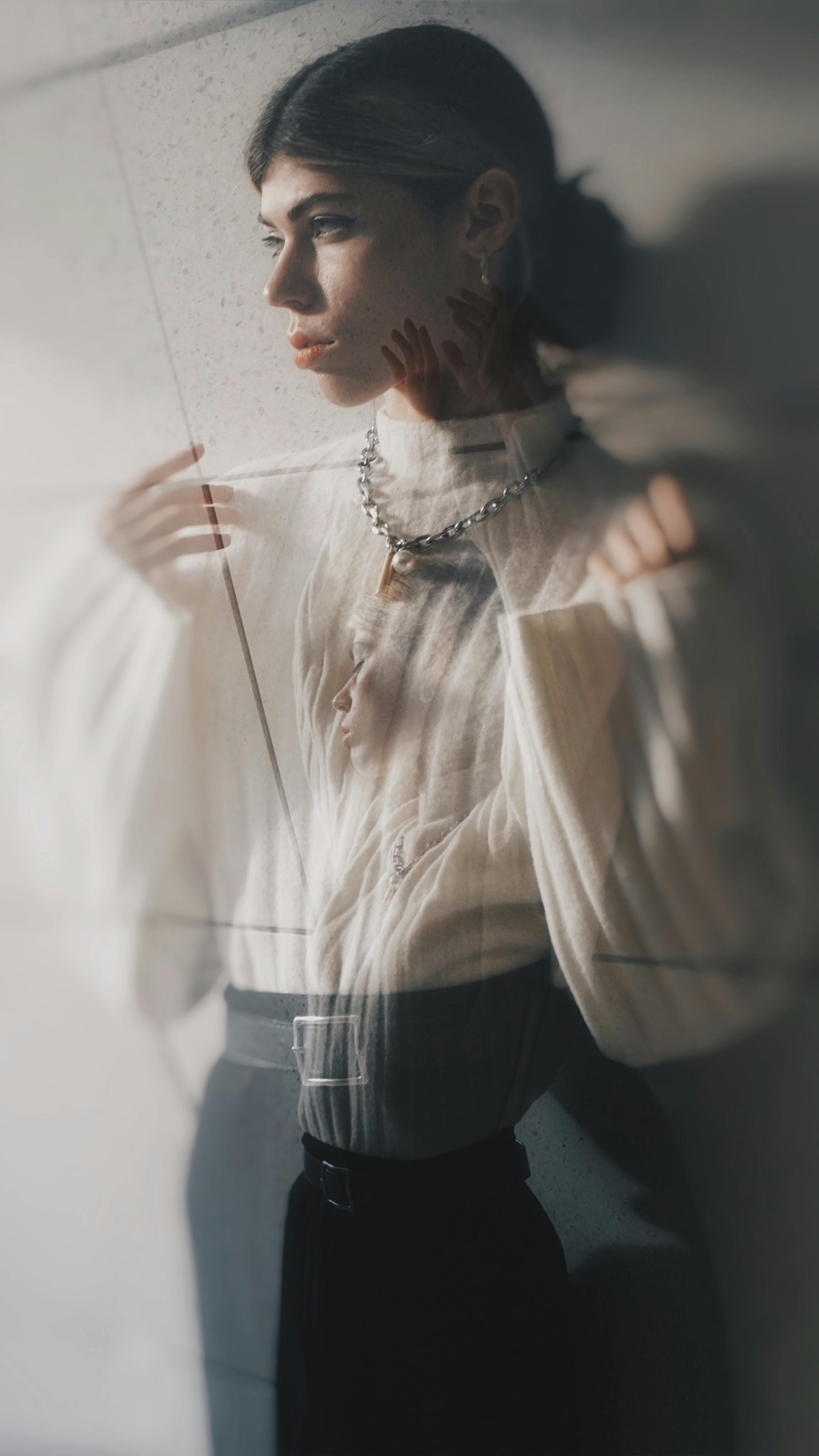 model posing in elegant sweater and skirt