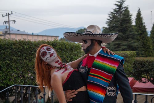 Free Man and Woman in Costumes and Makeup for the Day of the Dead Celebrations in Mexico  Stock Photo