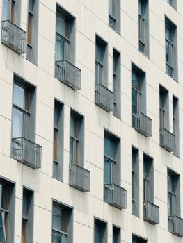 Close-up of a modern residential building facade with balconies in Shenzhen, China.