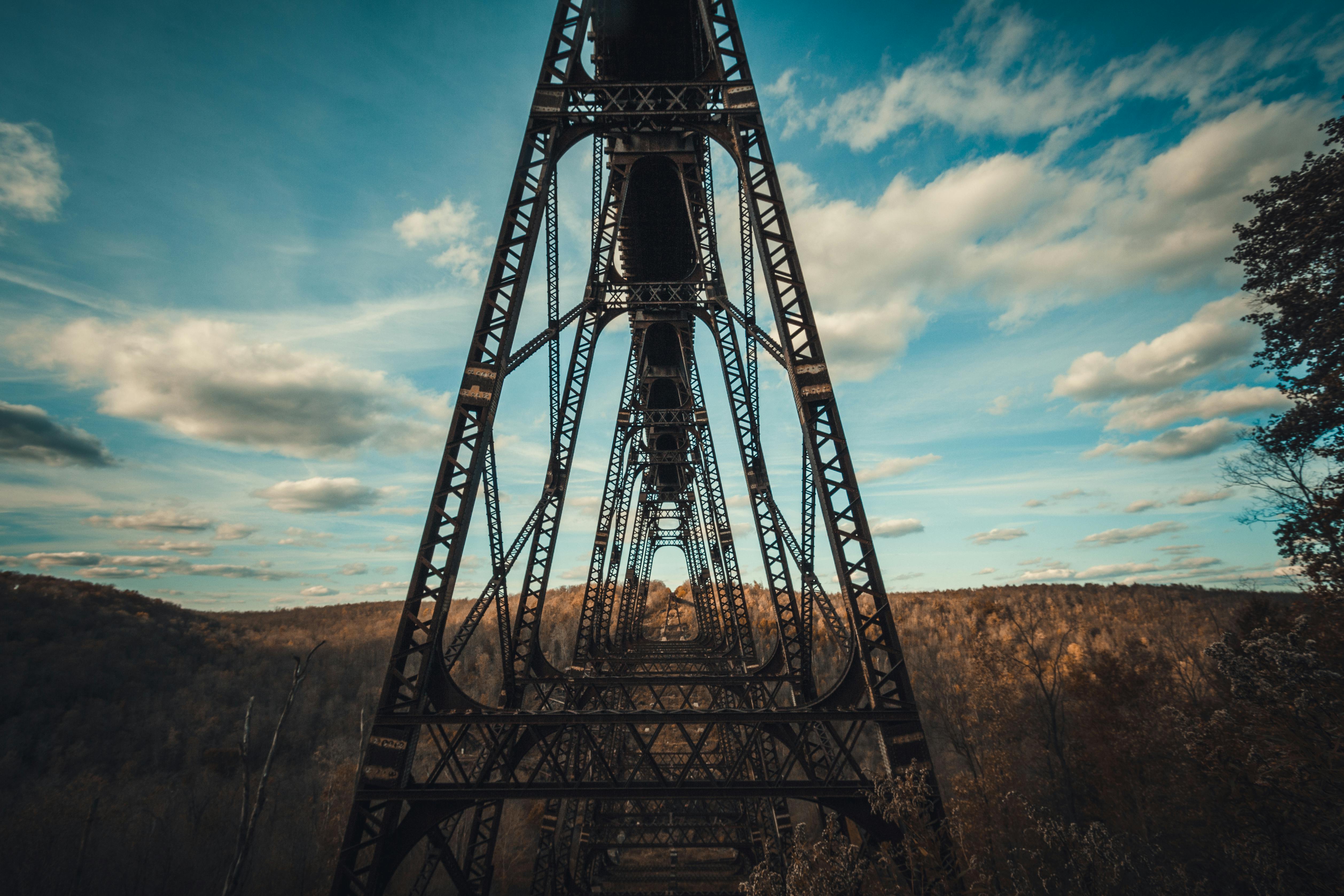Steel structure of the Kinzua Bridge amidst a scenic fall forest in Mount Jewett, PA.
